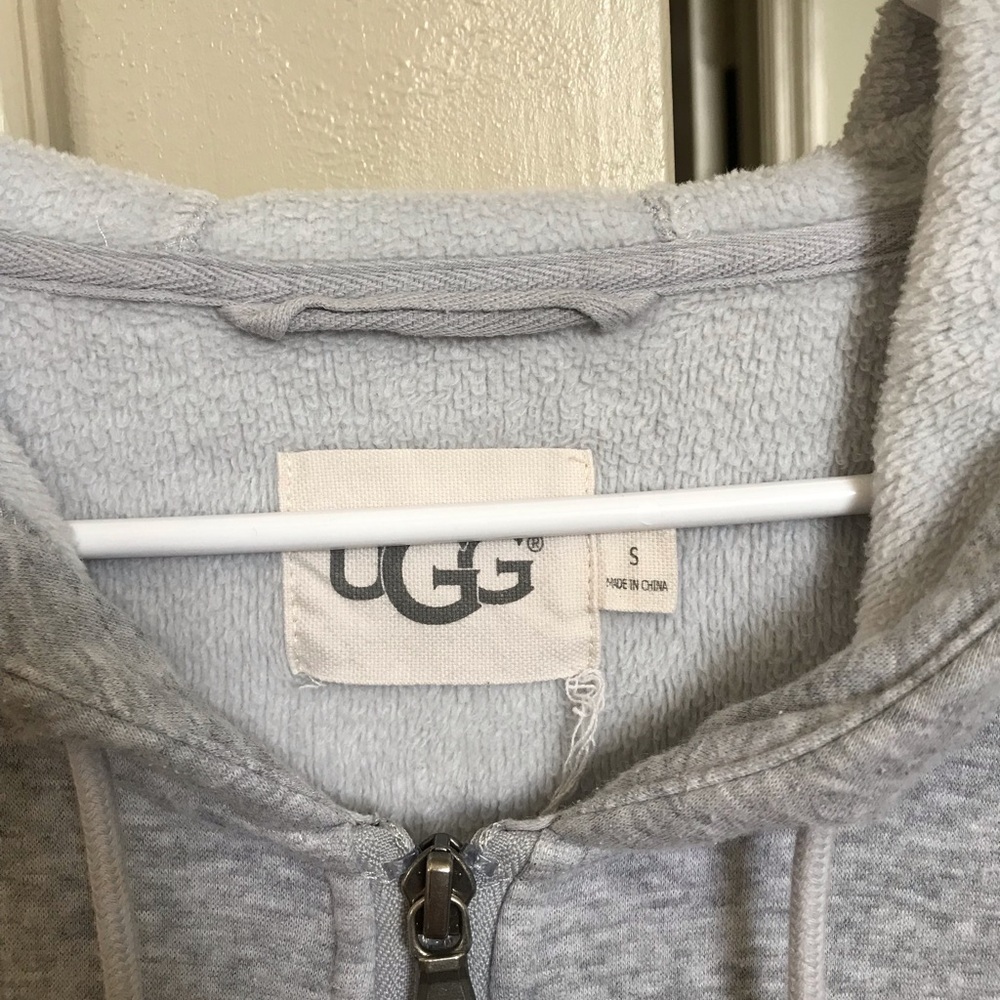 Grey UGG zip up sweater.